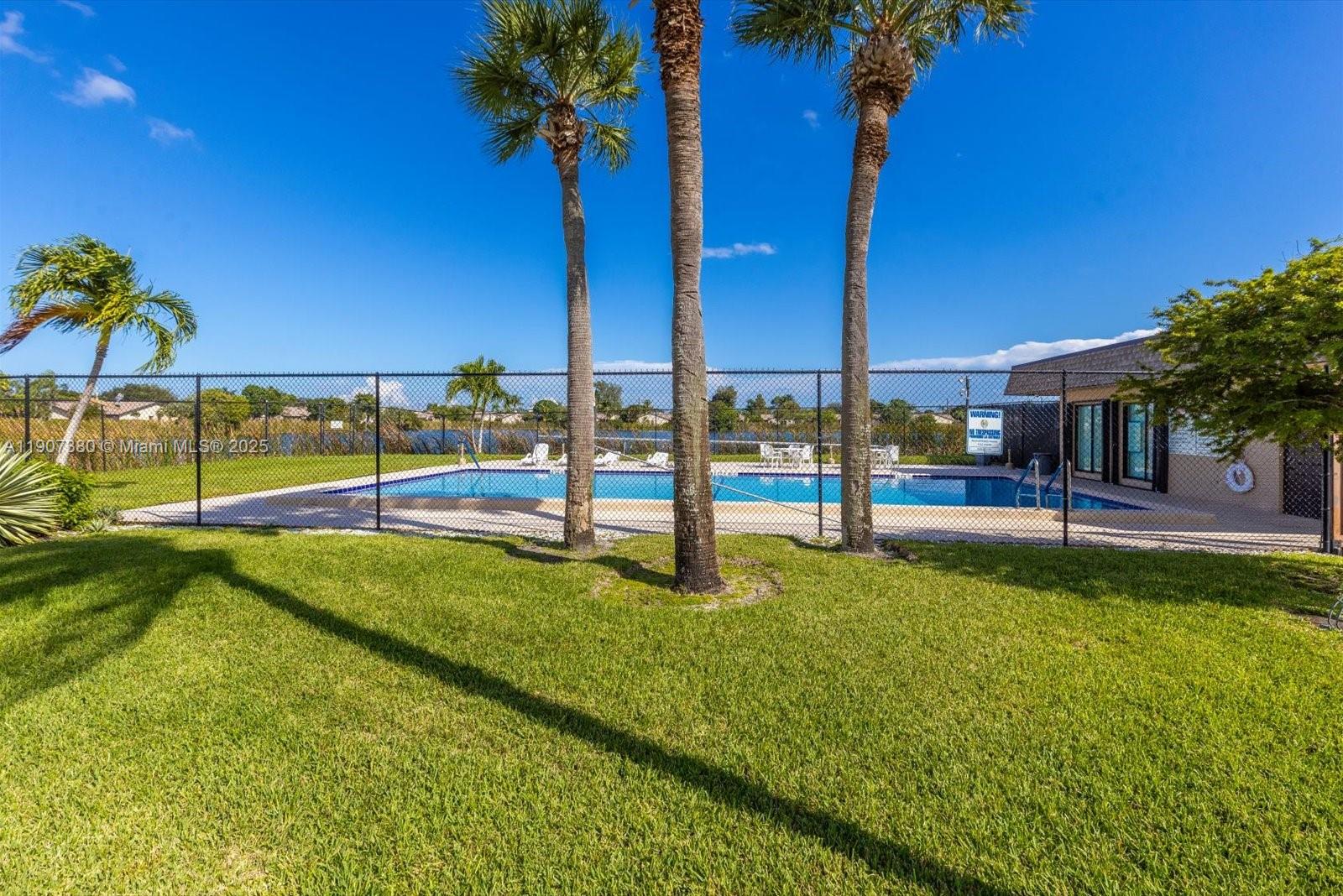 3502 Waterview Circle Palm Springs, FL 33461 - Photo 34 of 39 a view of a garden with an outdoor space