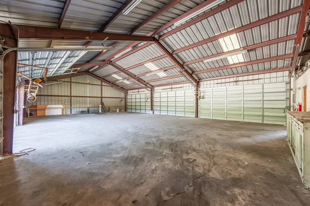 a view of a big room with wooden walls