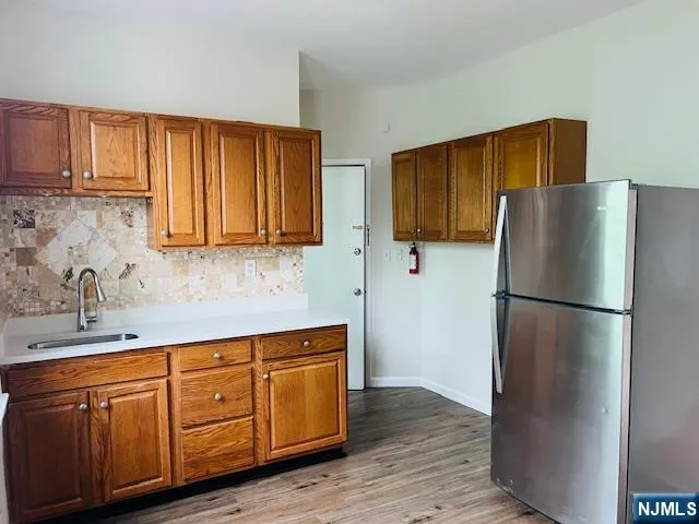 a white refrigerator freezer sitting inside of a kitchen