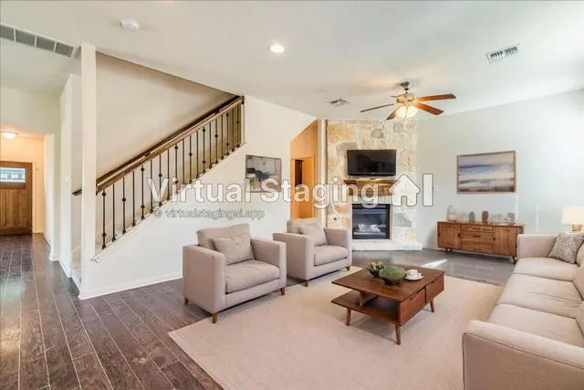 a living room with furniture fireplace and a flat screen tv