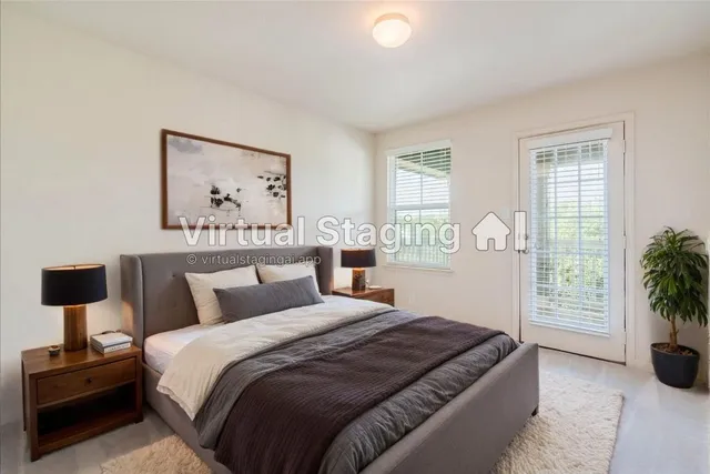 a bedroom with a bed and a potted plant