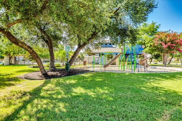 a view of yard with swimming pool