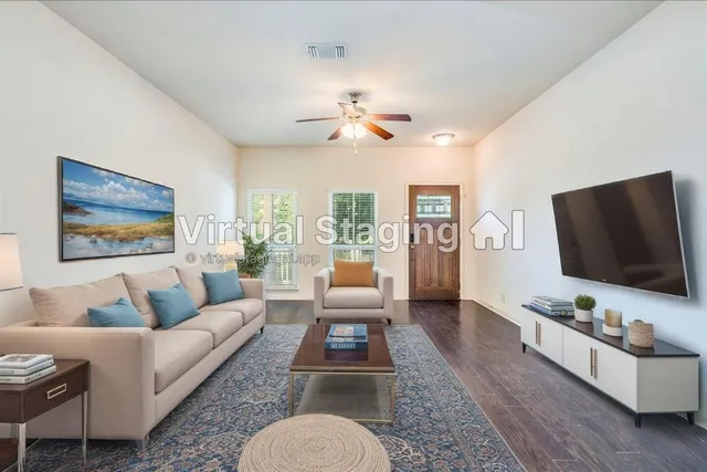 a living room with furniture and a flat screen tv