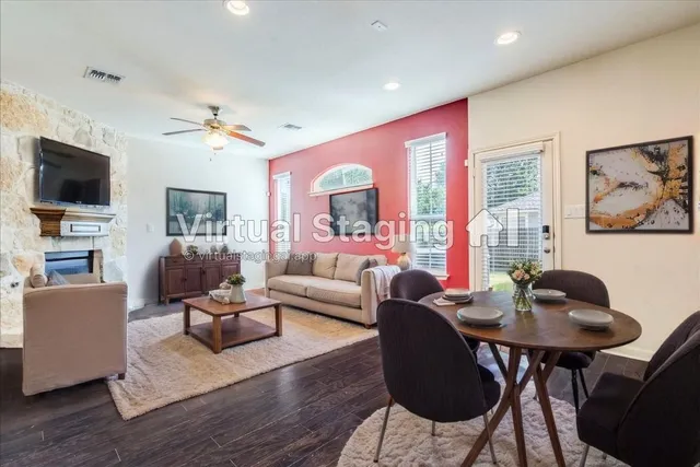 a living room with fireplace furniture and a flat screen tv