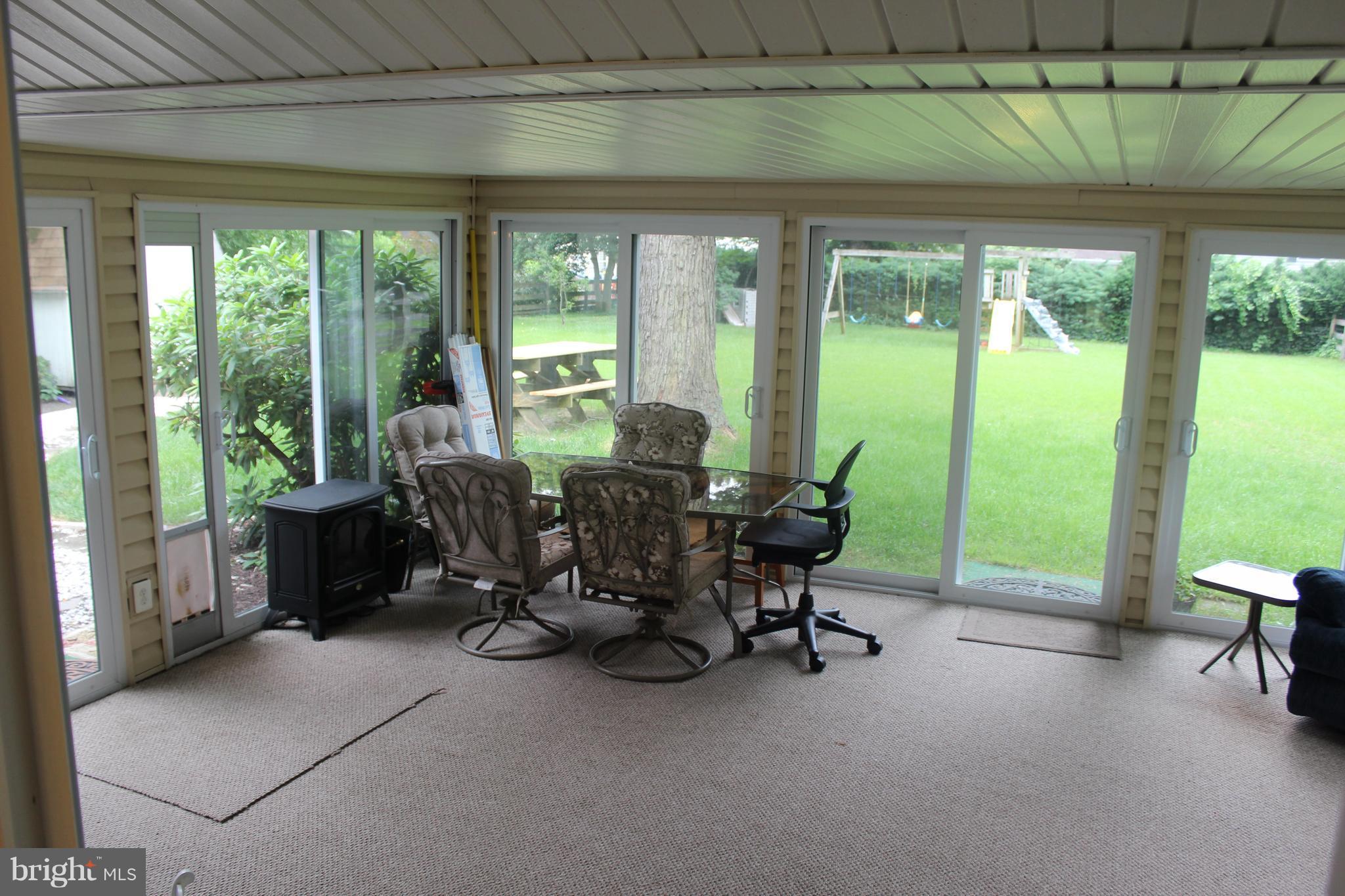 807 Pin Oak Road Severna Park, MD 21146 - Photo 17 of 29 7 sliders! Lots of light. Perfect yearround!
