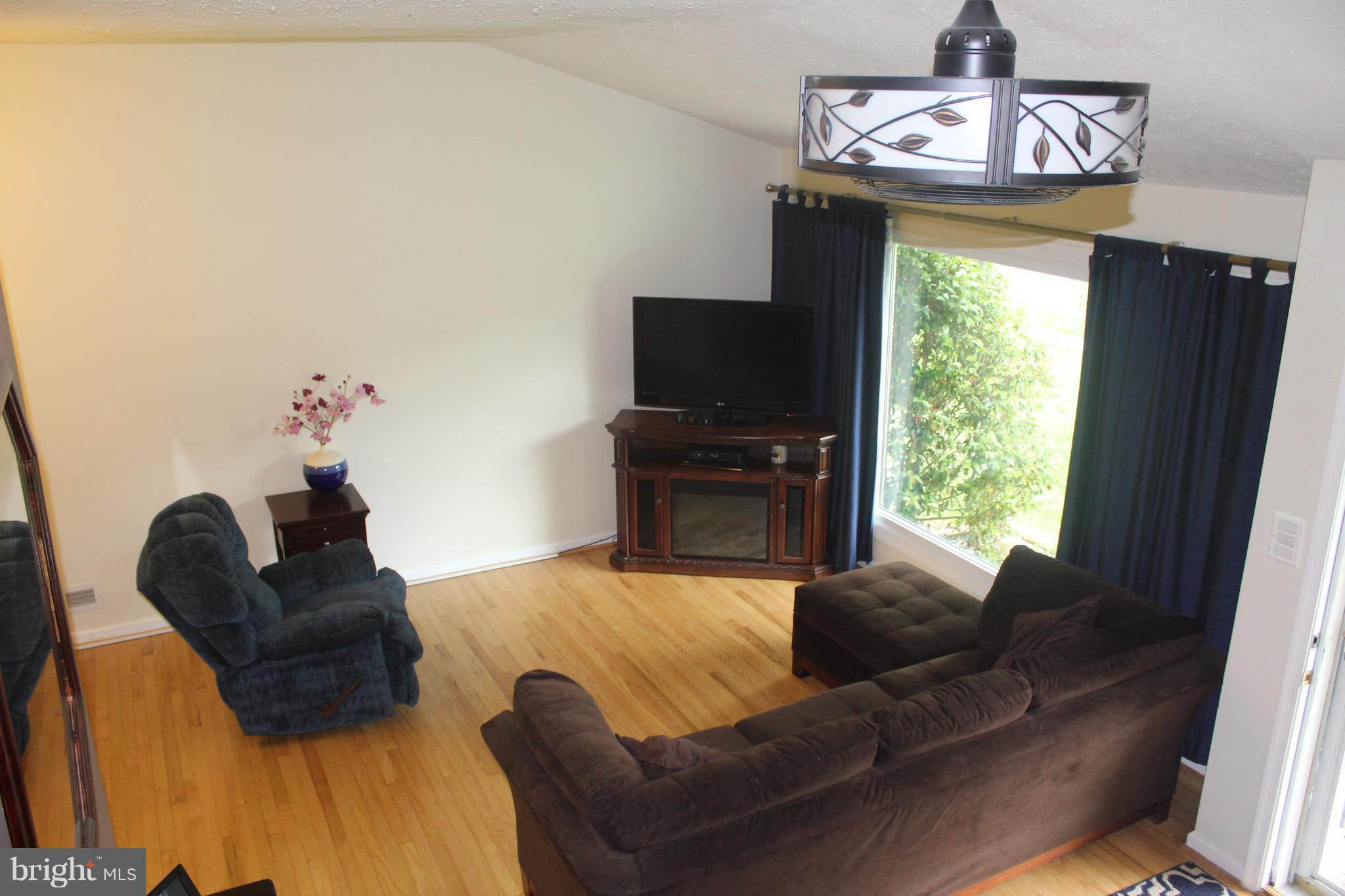 807 Pin Oak Road Severna Park, MD 21146 - Photo 4 of 29 Living room with hardwood and lots of light.
