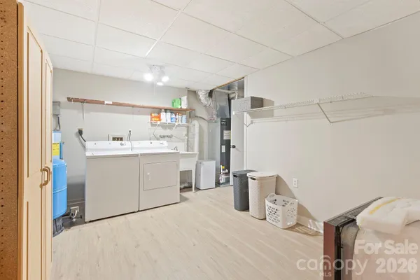a room with a bed and a cabinets