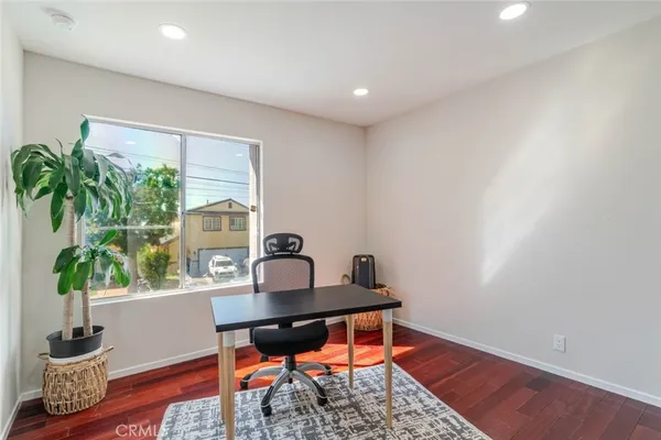 a workspace with furniture and a potted plant