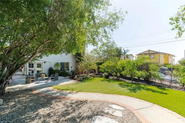 a view of a house with swimming pool and sitting area