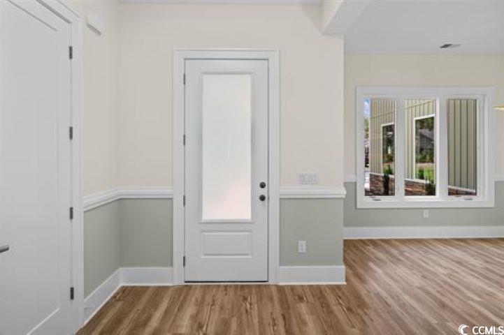 1028 Colette Court Conway, SC 29526 - Photo 13 of 39 Doorway to outside with wood finished floors