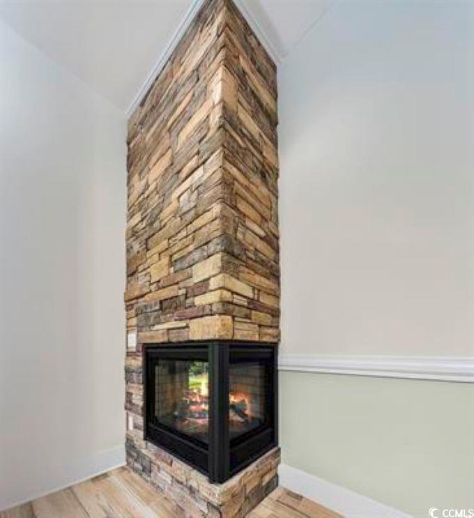 1028 Colette Court Conway, SC 29526 - Photo 14 of 39 Detailed view of a fireplace and wood finished floors