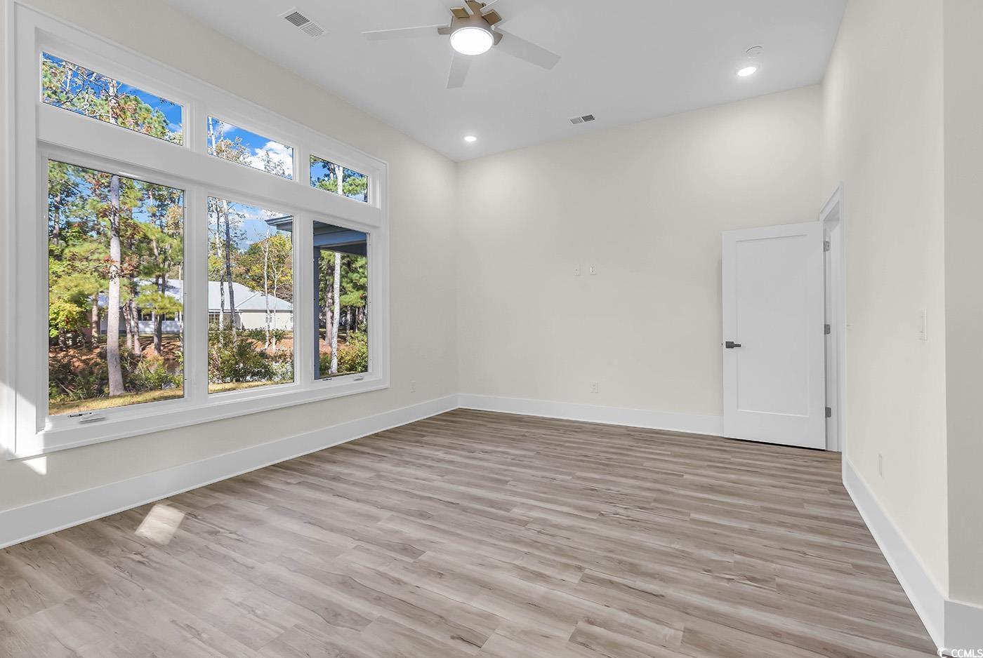 1028 Colette Court Conway, SC 29526 - Photo 16 of 39 Spare room featuring light wood-style flooring, recessed lighting, and a ceiling fan