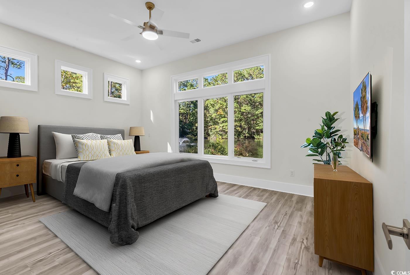 1028 Colette Court Conway, SC 29526 - Photo 19 of 39 Bedroom featuring multiple windows, light wood finished floors, ceiling fan, and recessed lighting