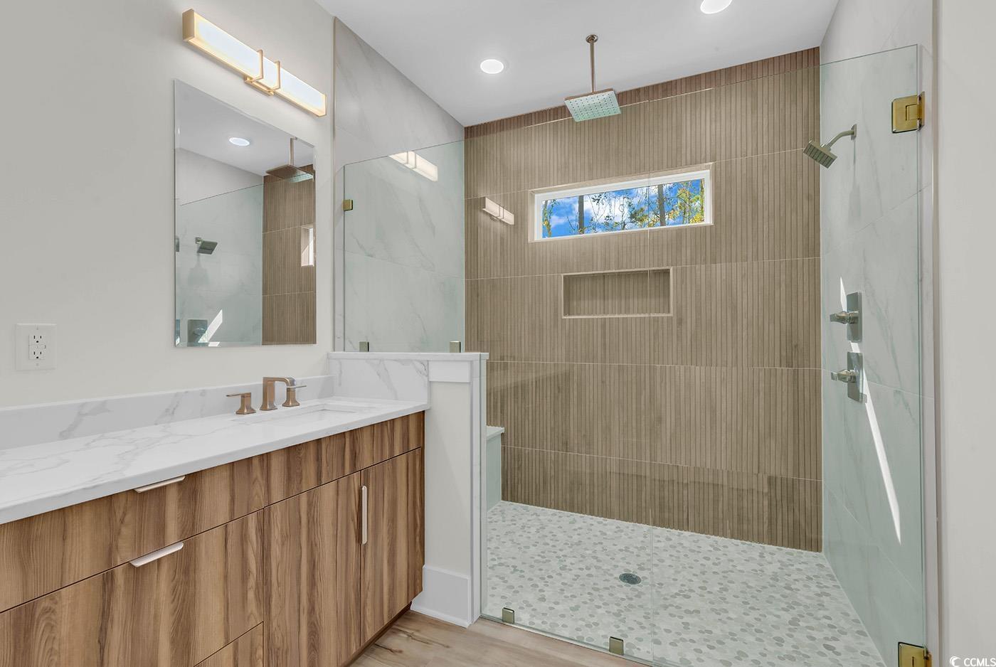 1028 Colette Court Conway, SC 29526 - Photo 20 of 39 Full bath featuring vanity, a walk in shower, recessed lighting, and light wood-type flooring