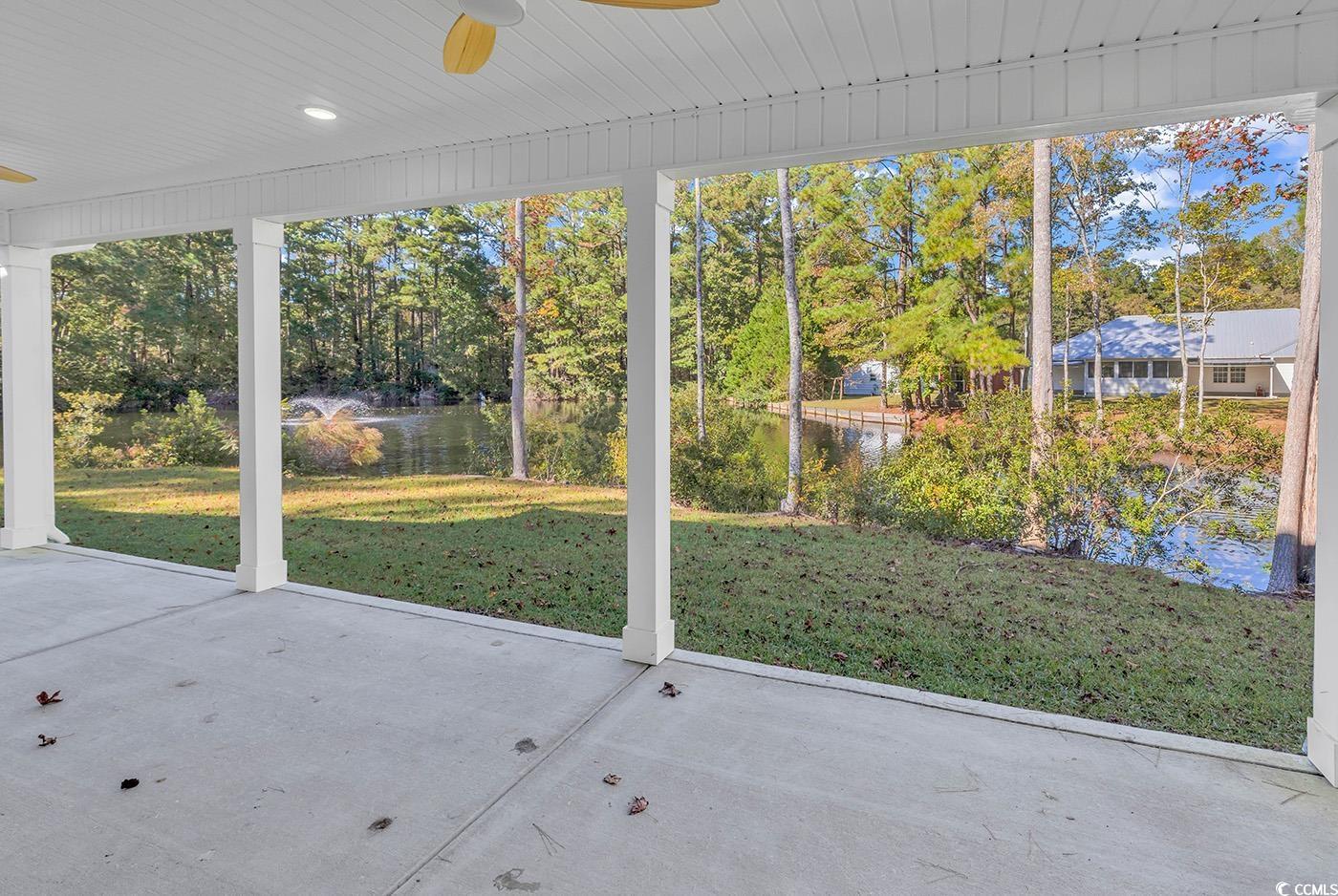 1028 Colette Court Conway, SC 29526 - Photo 32 of 39 Unfurnished sunroom featuring a water view, view of wooded area, and a patio area
