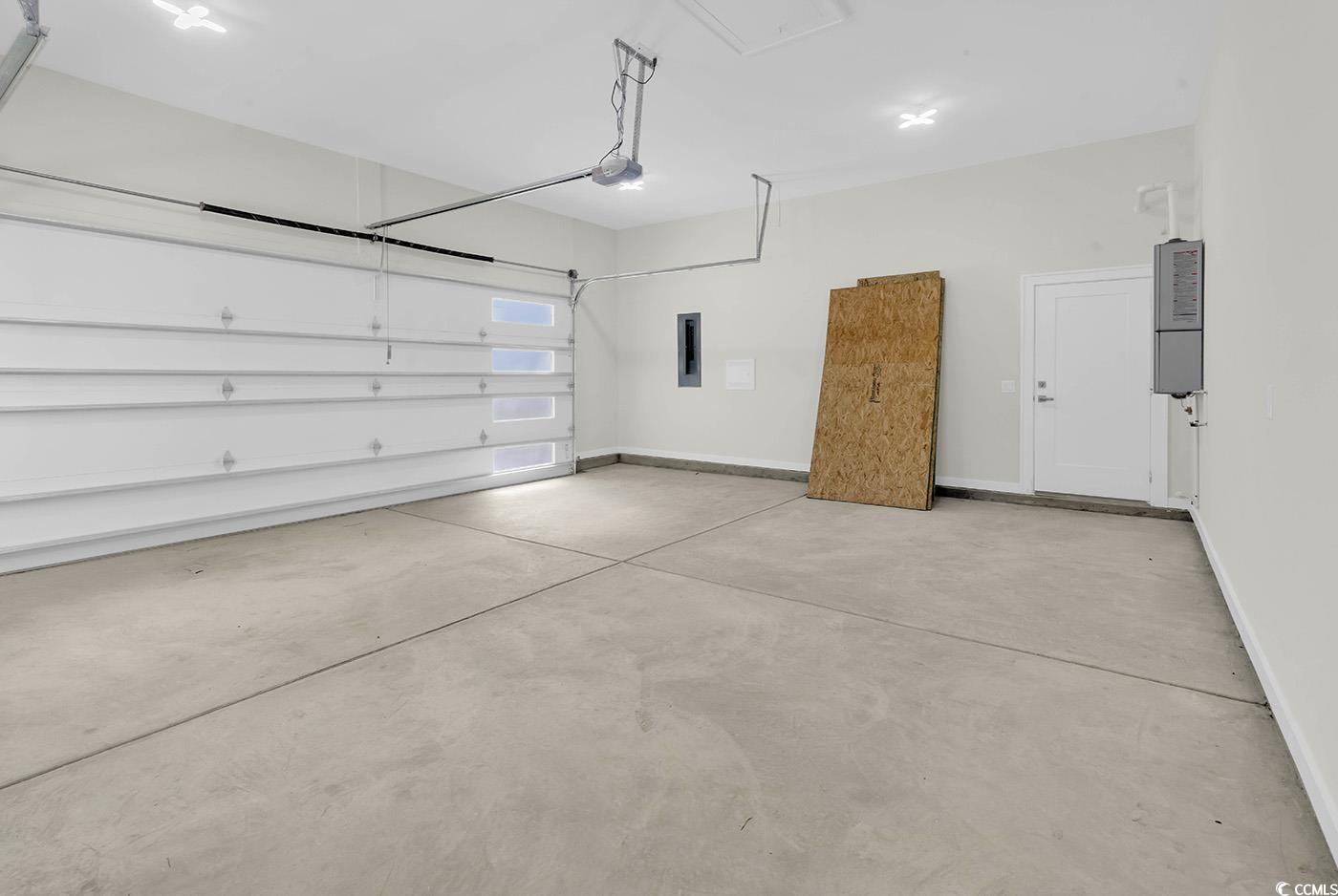 1028 Colette Court Conway, SC 29526 - Photo 36 of 39 Garage with baseboards and electric panel