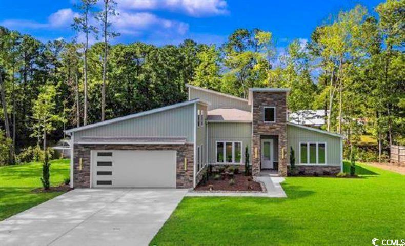 1028 Colette Court Conway, SC 29526 - Photo 39 of 39 Mid-century inspired home with stone siding, a front lawn, and driveway