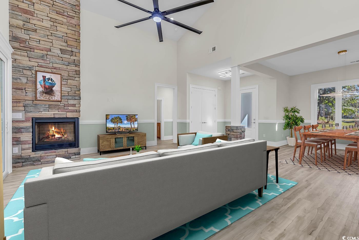1028 Colette Court Conway, SC 29526 - Photo 10 of 39 Living area featuring light wood-style floors, a fireplace, ceiling fan, and high vaulted ceiling