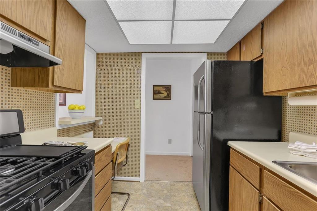 3445 Ivys Walk Atlanta, GA 30340 - Photo 8 of 21 a kitchen with stainless steel appliances granite countertop a refrigerator and a stove