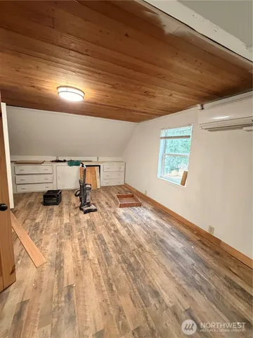 a view of an empty room and wooden floor