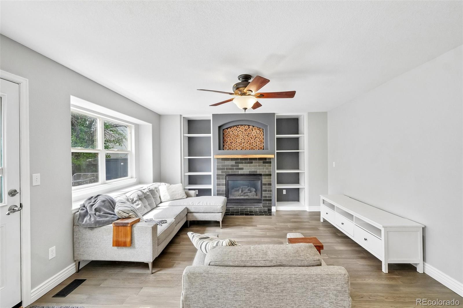 6642 Tiger Tooth Lone Tree, CO 80124 - Photo 11 of 44 a living room with furniture and a window