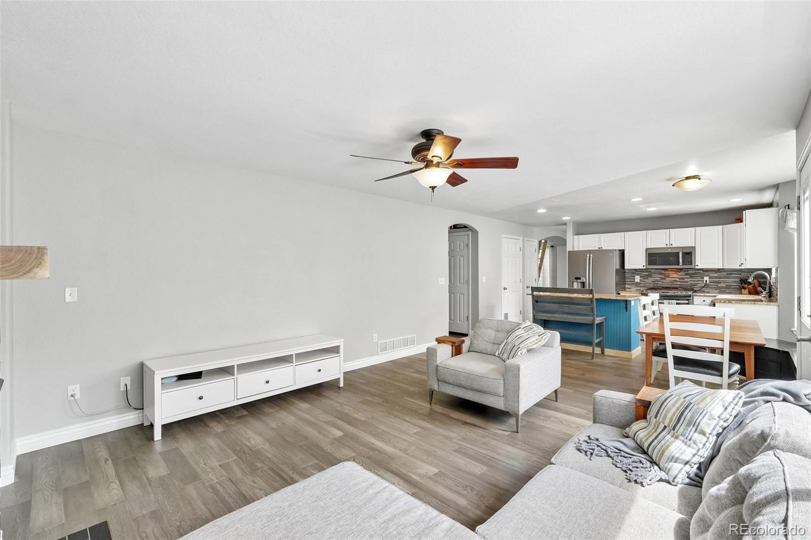 6642 Tiger Tooth Lone Tree, CO 80124 - Photo 14 of 44 a living room with furniture and kitchen view
