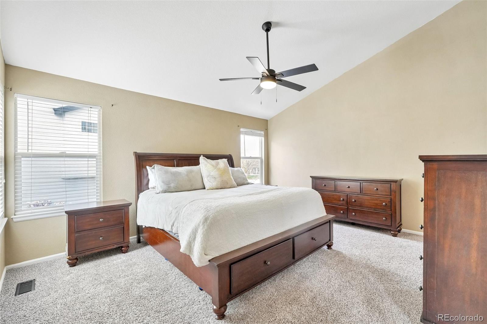 6642 Tiger Tooth Lone Tree, CO 80124 - Photo 26 of 44 a bedroom with bed and window