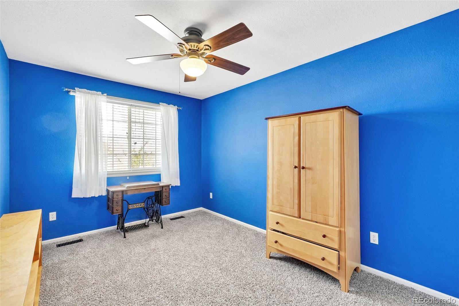 6642 Tiger Tooth Lone Tree, CO 80124 - Photo 31 of 44 a view of workspace with window and a ceiling fan