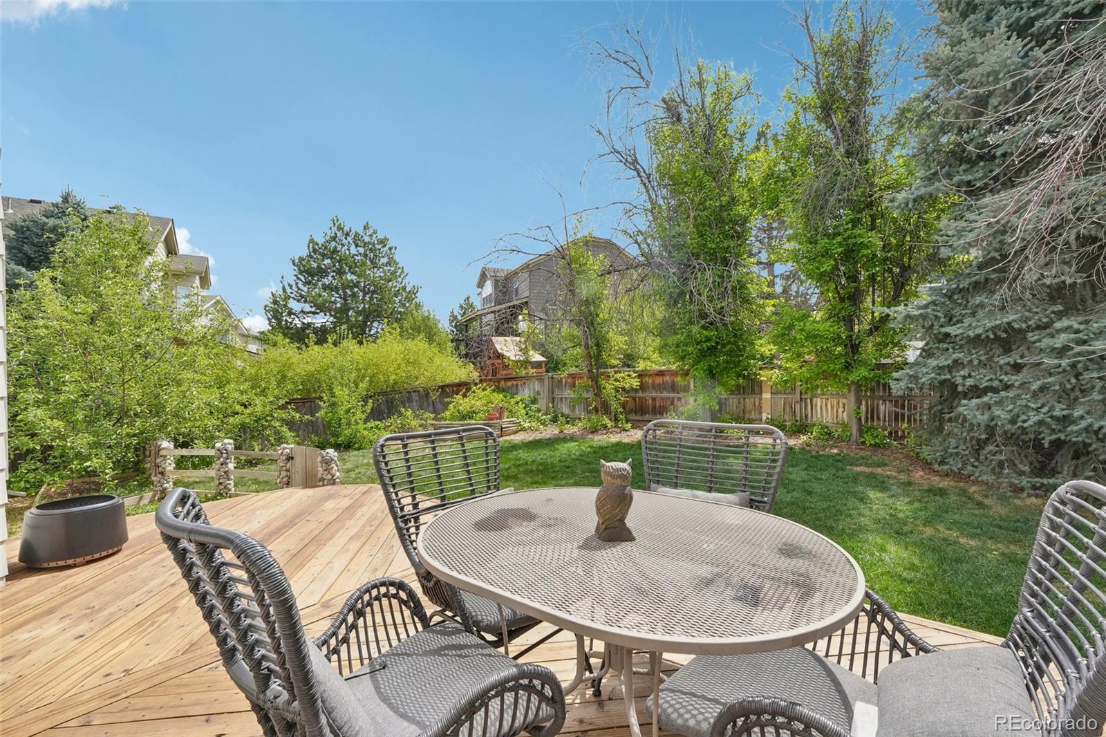 6642 Tiger Tooth Lone Tree, CO 80124 - Photo 35 of 44 a terrace with outdoor seating and trees