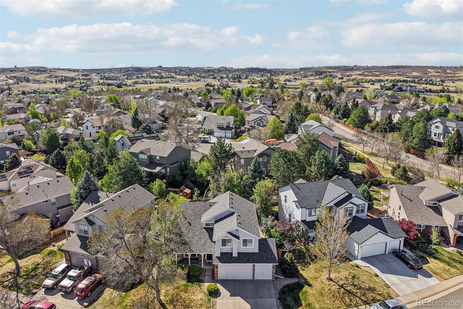 6642 Tiger Tooth Lone Tree, CO 80124 - Photo 41 of 44 an aerial view of a city with lots of residential buildings