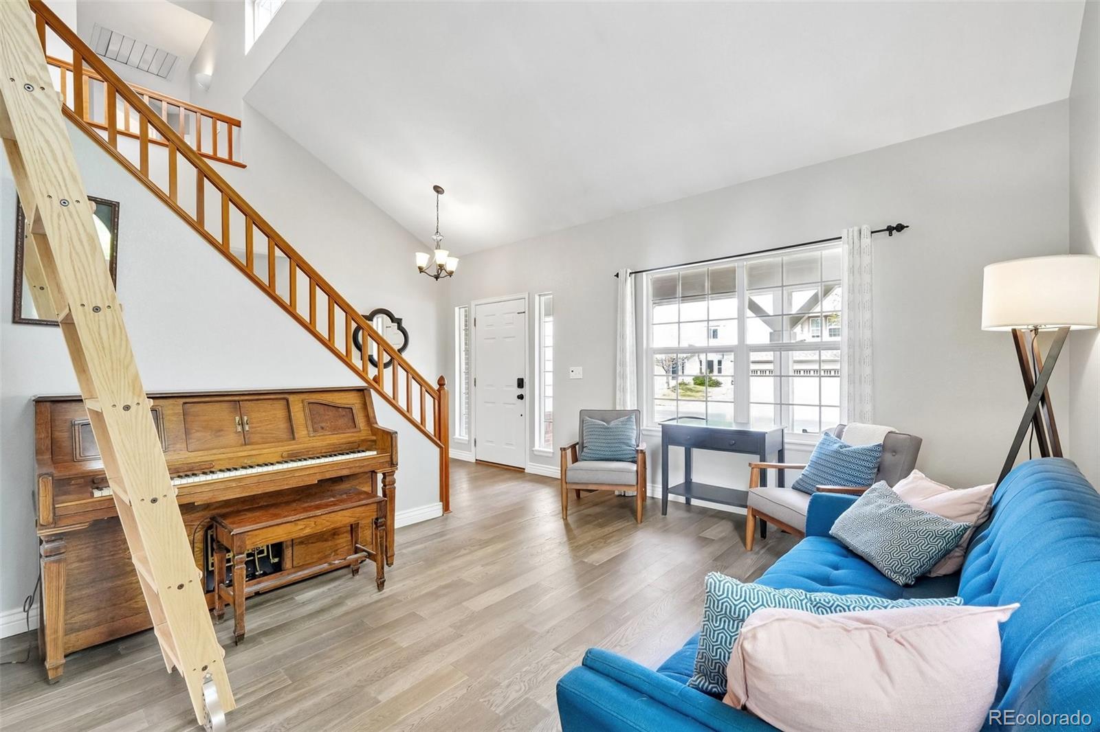 6642 Tiger Tooth Lone Tree, CO 80124 - Photo 6 of 44 a living room with furniture and a wooden floor