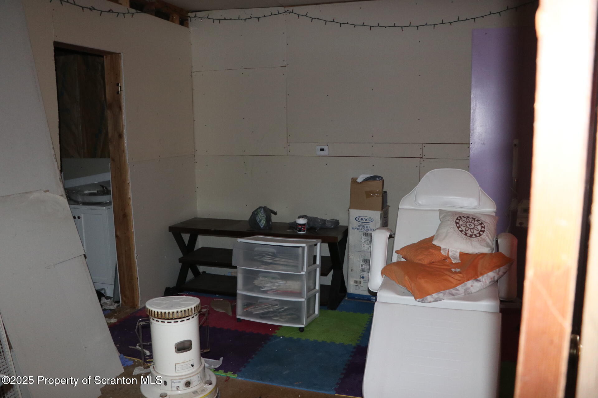 74 Matthews Road Moscow, PA 18444 - Photo 23 of 33 a room with furniture and a potted plant