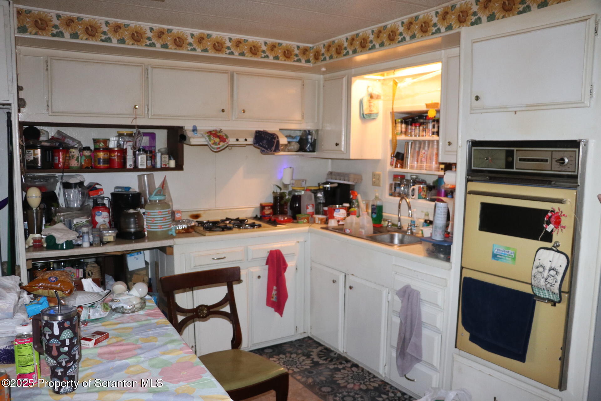 74 Matthews Road Moscow, PA 18444 - Photo 29 of 33 a kitchen with stainless steel appliances a stove a sink and cabinets