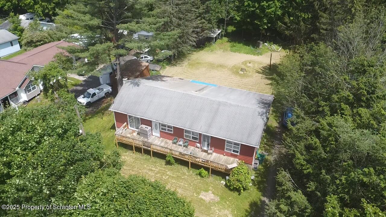 74 Matthews Road Moscow, PA 18444 - Photo 3 of 33 an aerial view of a house with a yard and large trees