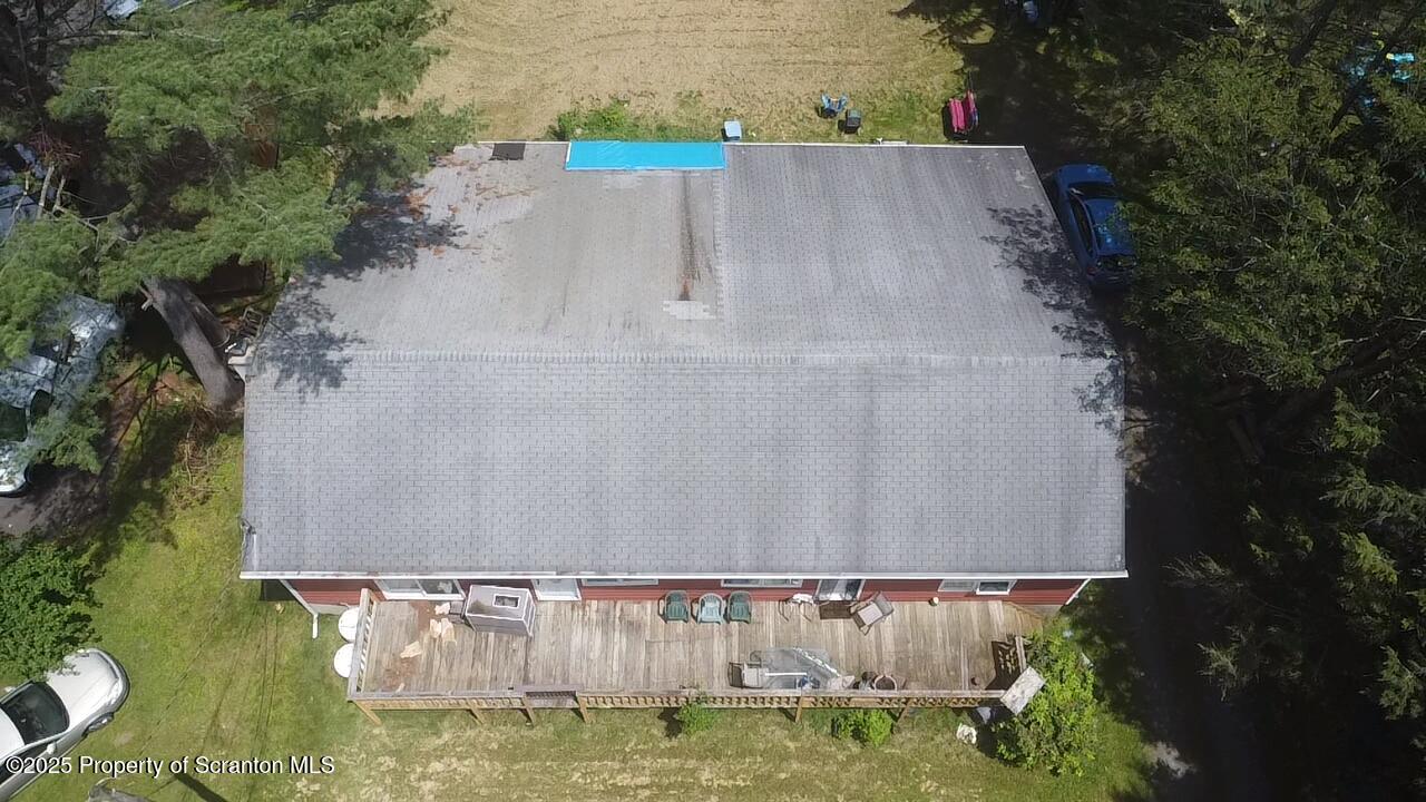 74 Matthews Road Moscow, PA 18444 - Photo 6 of 33 an aerial view of a house with swimming pool and garden
