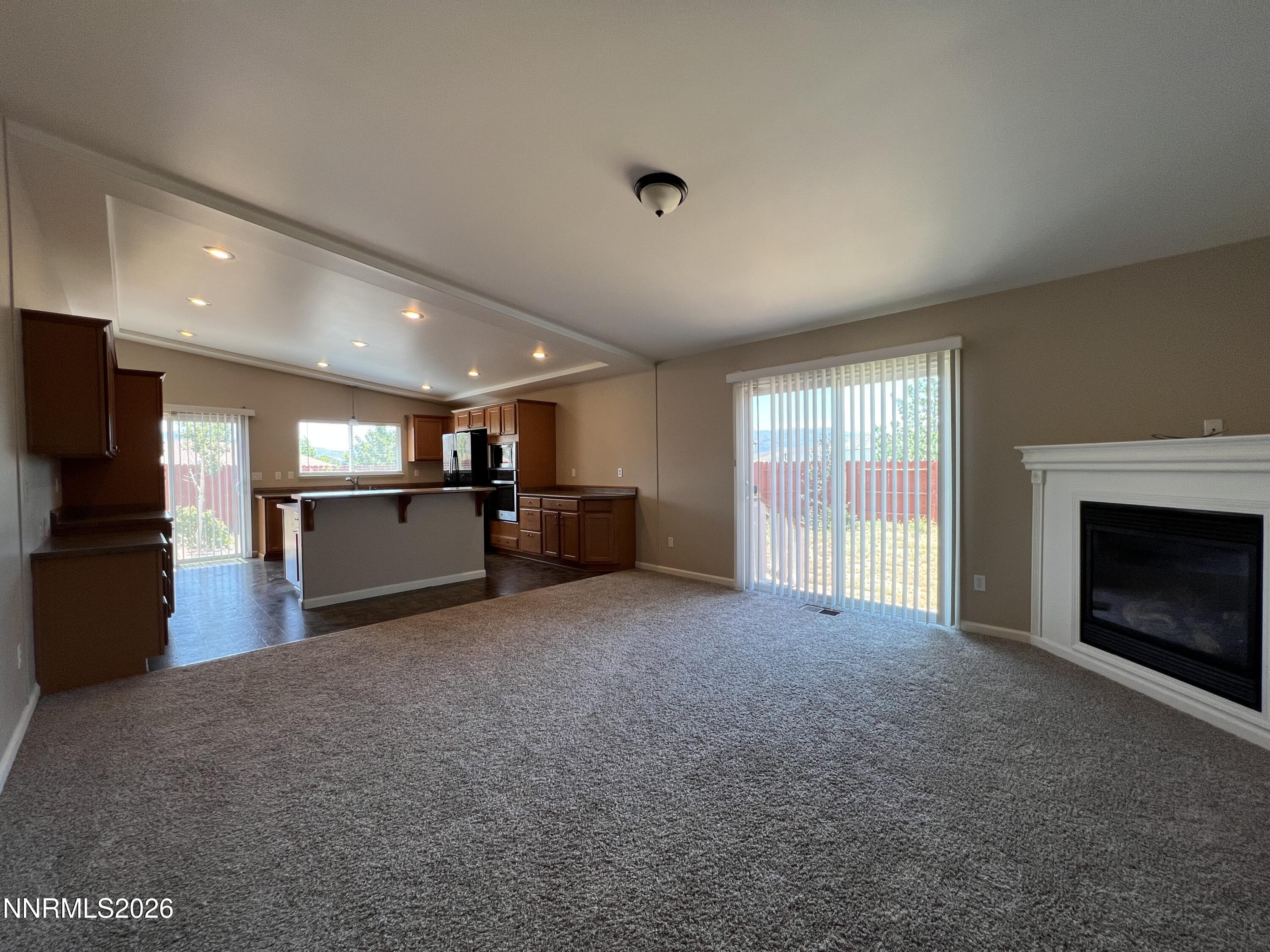 18406 Teddy Bear Court Reno, NV 89508 - Photo 5 of 44 a view of an empty room with a fireplace