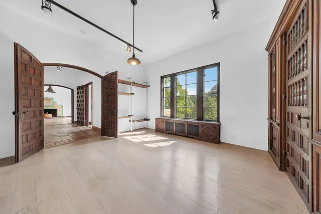 a view of a room with window and wooden floor