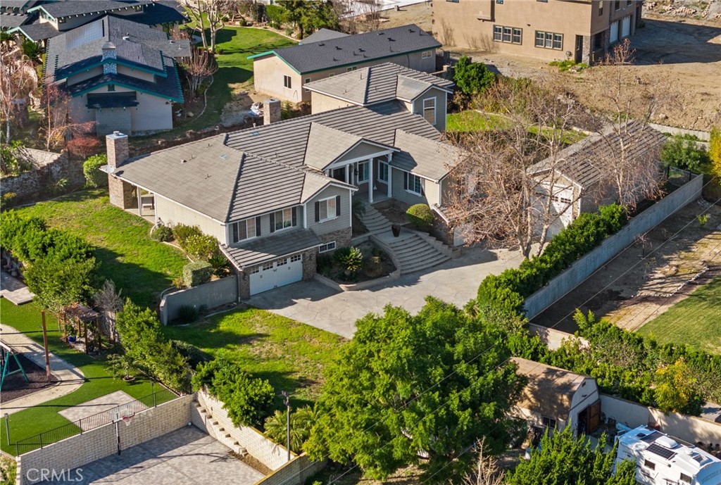 5836 Buckthorn Avenue Rancho Cucamonga, CA 91737 - Photo 2 of 63 an aerial view of multiple houses with yard