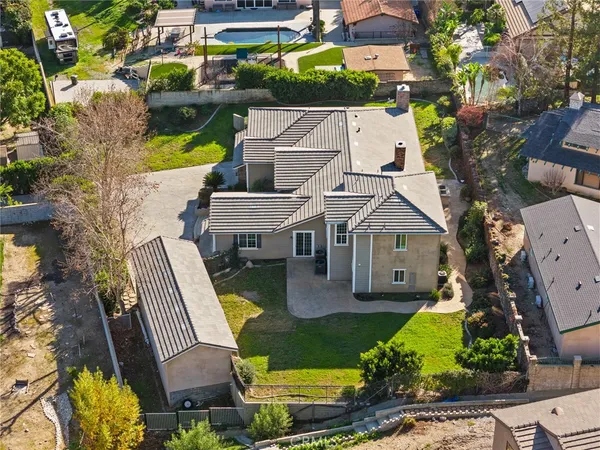 an aerial view of residential houses with outdoor space
