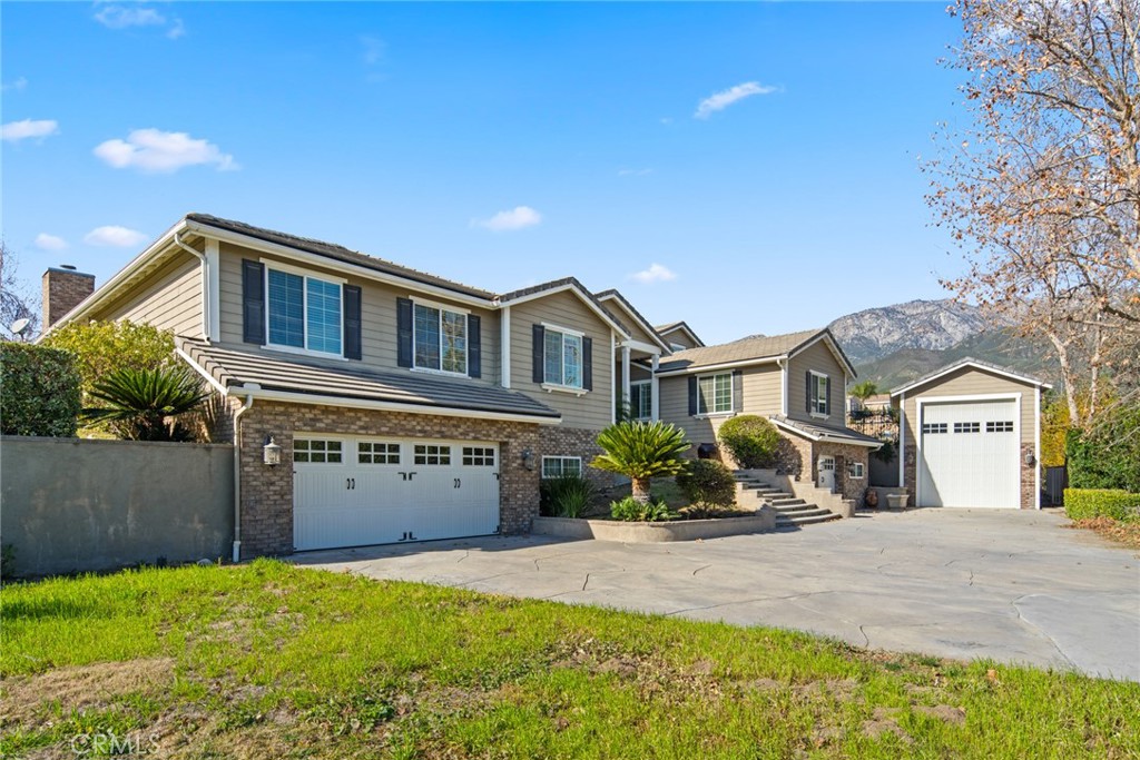 5836 Buckthorn Avenue Rancho Cucamonga, CA 91737 - Photo 32 of 63 a front view of a house with a yard