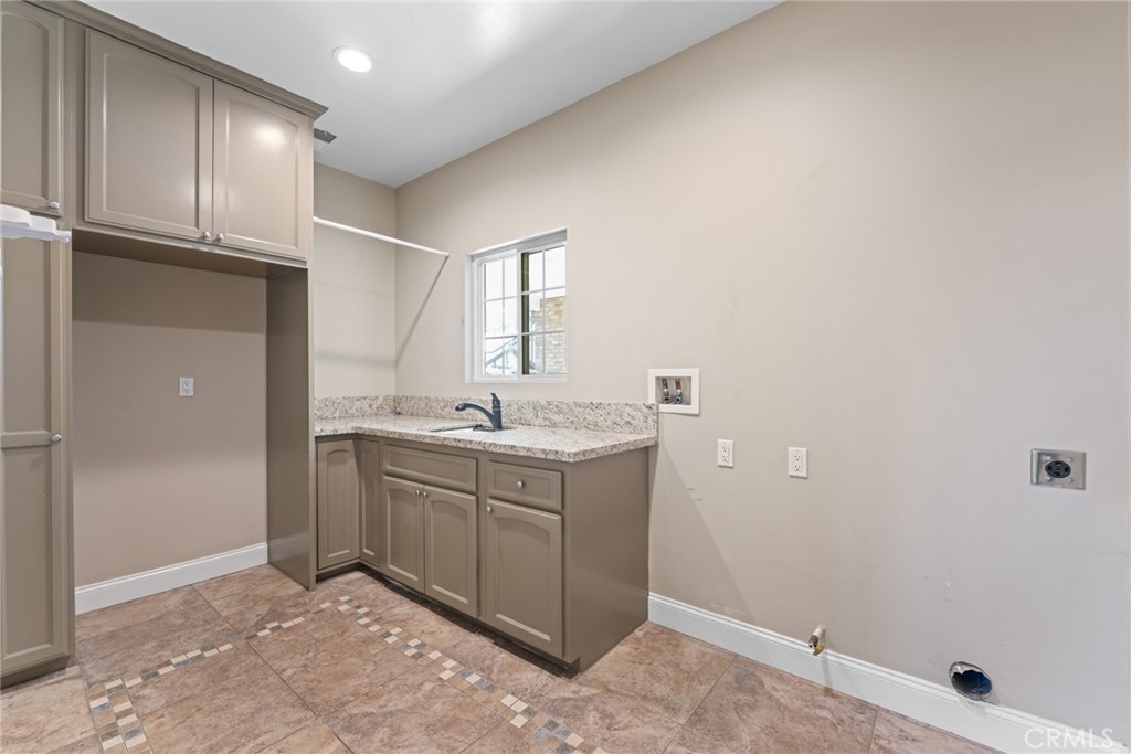 5836 Buckthorn Avenue Rancho Cucamonga, CA 91737 - Photo 33 of 63 a room with a sink cabinets and utility room