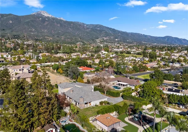 an aerial view of residential houses with outdoor space