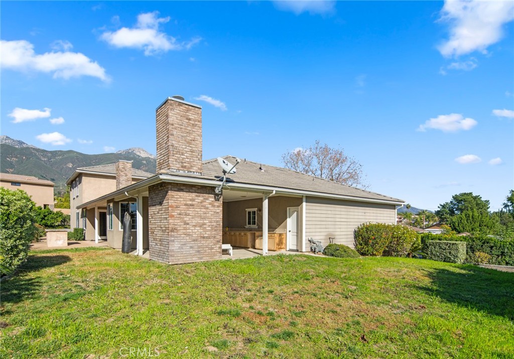 5836 Buckthorn Avenue Rancho Cucamonga, CA 91737 - Photo 41 of 63 a front view of a house with garden