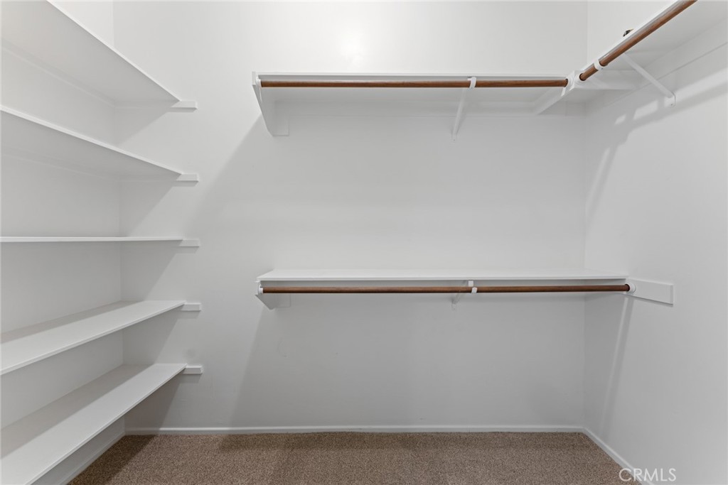 5836 Buckthorn Avenue Rancho Cucamonga, CA 91737 - Photo 46 of 63 a view of walk in closet with empty racks
