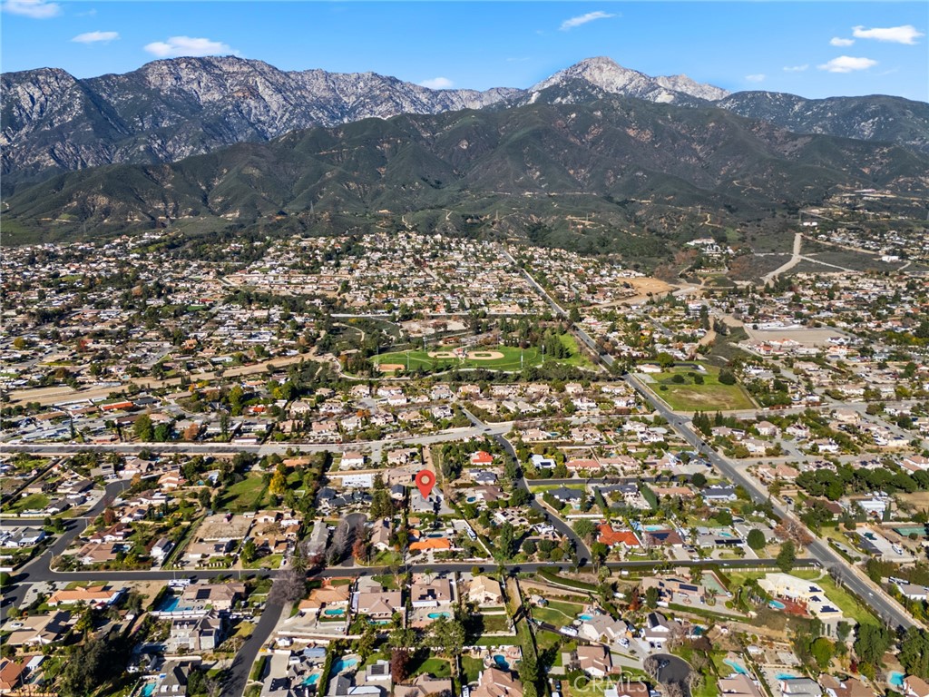 5836 Buckthorn Avenue Rancho Cucamonga, CA 91737 - Photo 62 of 63 a view of a house with a mountain