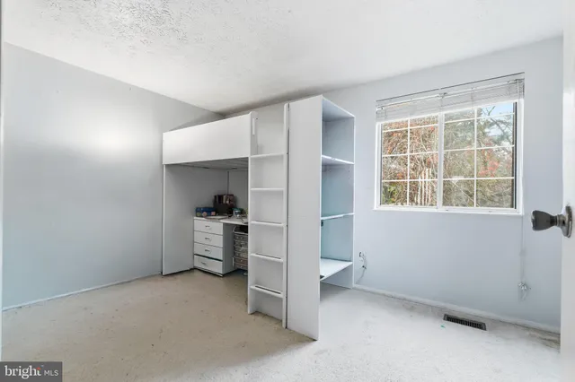 a view of a kitchen with a sink stove and a window