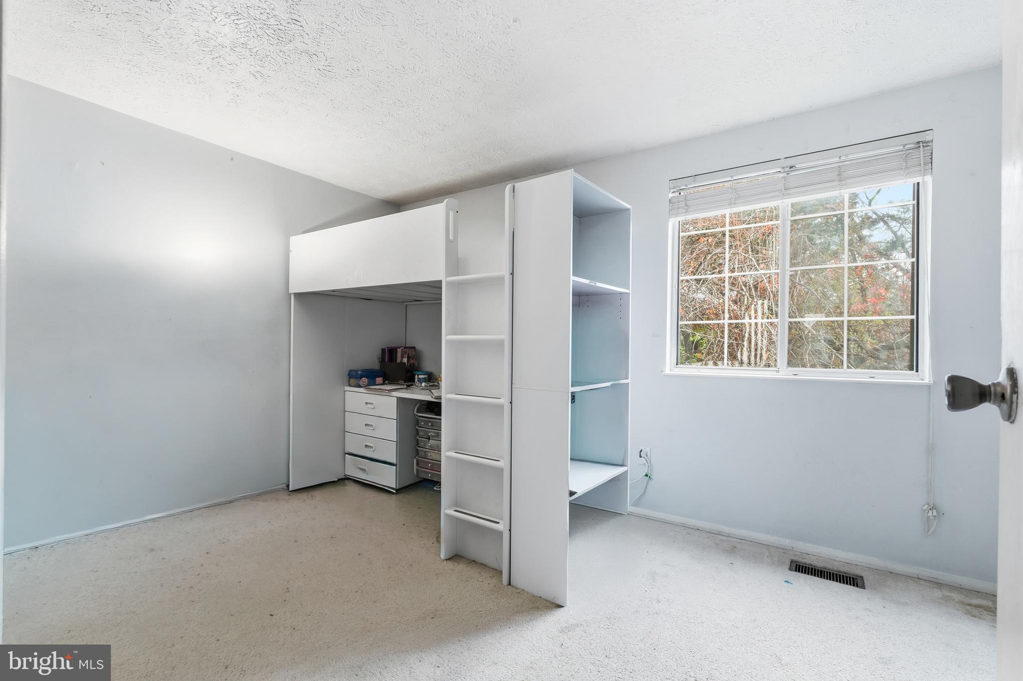 19218 Misty Meadow Terrace Germantown, MD 20874 - Photo 11 of 17 a view of a kitchen with a sink stove and a window
