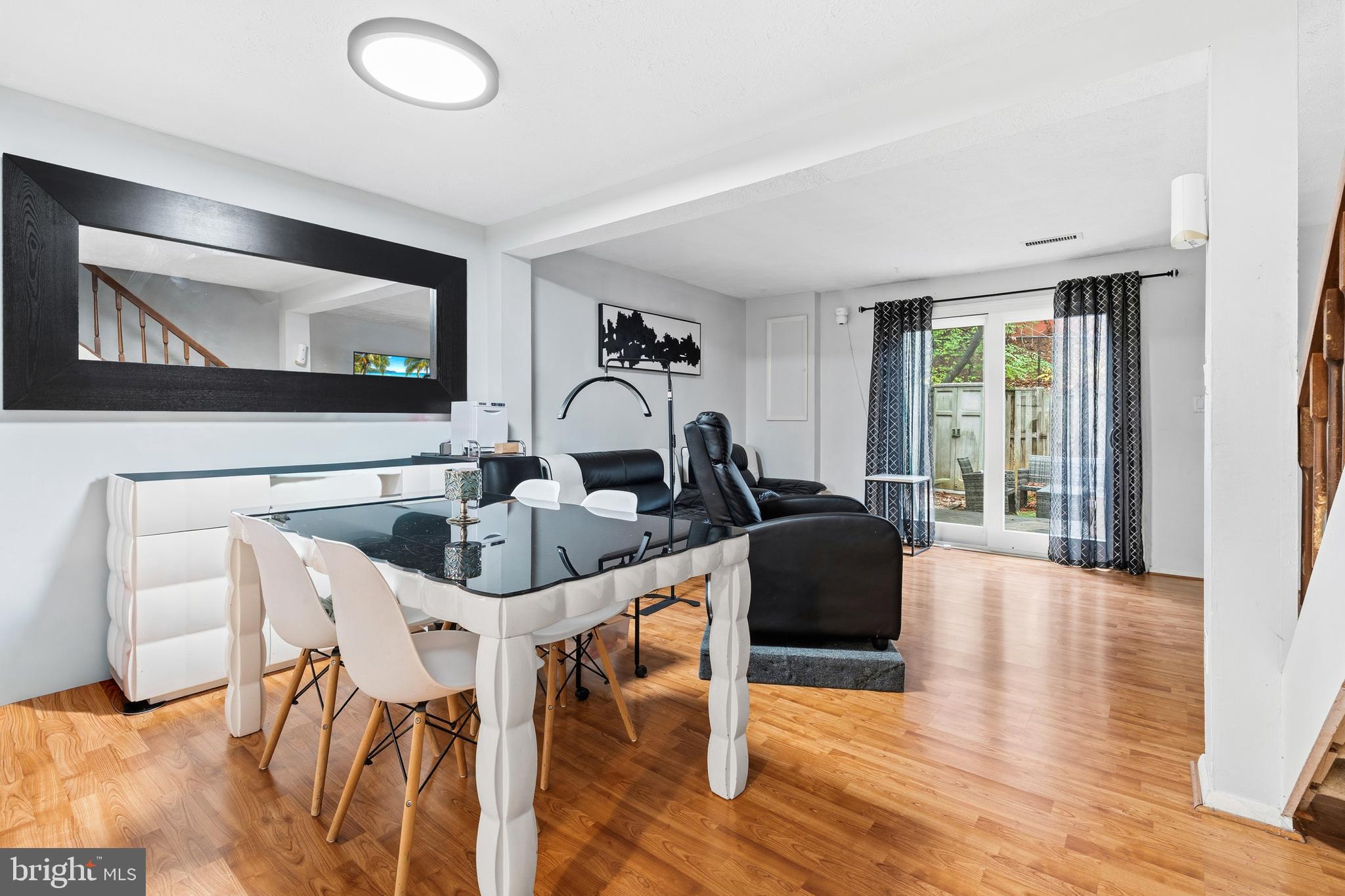 19218 Misty Meadow Terrace Germantown, MD 20874 - Photo 5 of 17 a living room with furniture and a large window