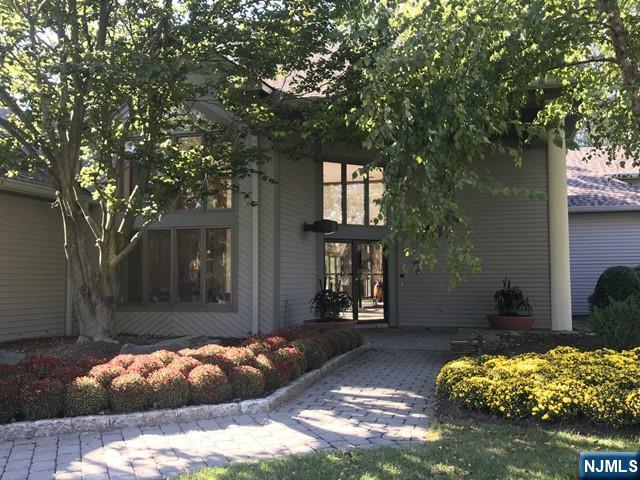 201 Beech Court Norwood, NJ 07648 - Photo 5 of 12 front view of a house with a yard