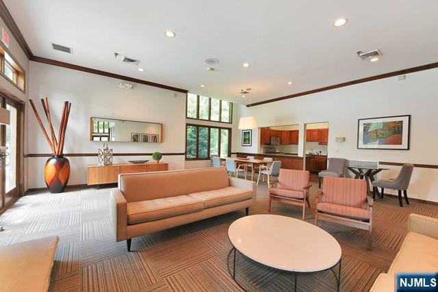 201 Beech Court Norwood, NJ 07648 - Photo 6 of 12 a living room with furniture a rug and a large window